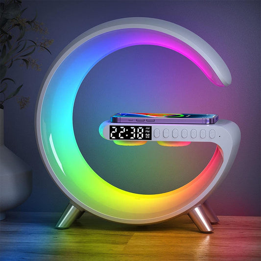 A colorful circular charger lamp with a digital display and multiple lighting bands, set on a wooden surface in a dimly lit room, displaying a time and app icons on the digital screen.